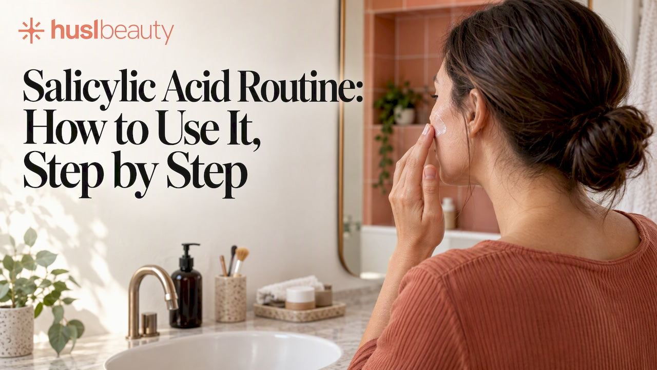 Woman applying skincare treatment at a bathroom vanity